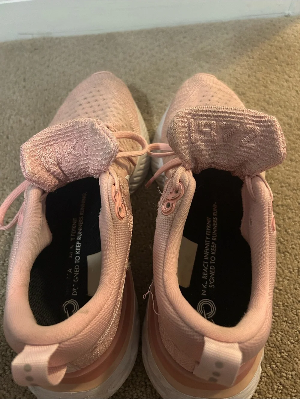 Nike Women's React Infinity Run Flyknit 2 Running Shoes in Pink Glaze